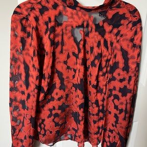 Babaton semi-sheer navy blue blouse with burnt orange brocade detail high neck.